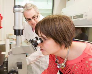 Christine Garrett and Kienan in the lab