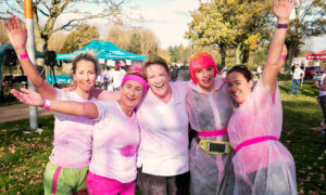 Pink Run participants covered in pink powder