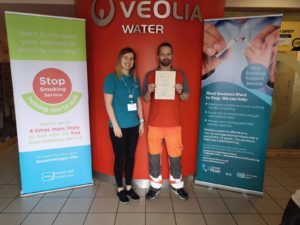 Lee Foster receives his stop smoking certificate from Trudy Barnes, Cancer Focus NI stop smoking specialist